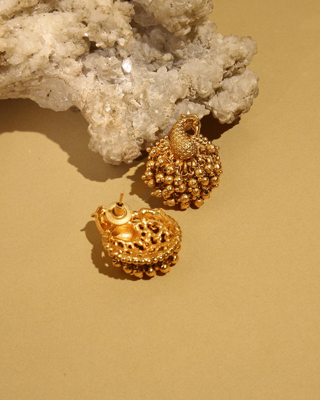 Sunehri gold tone peacock stud earrings