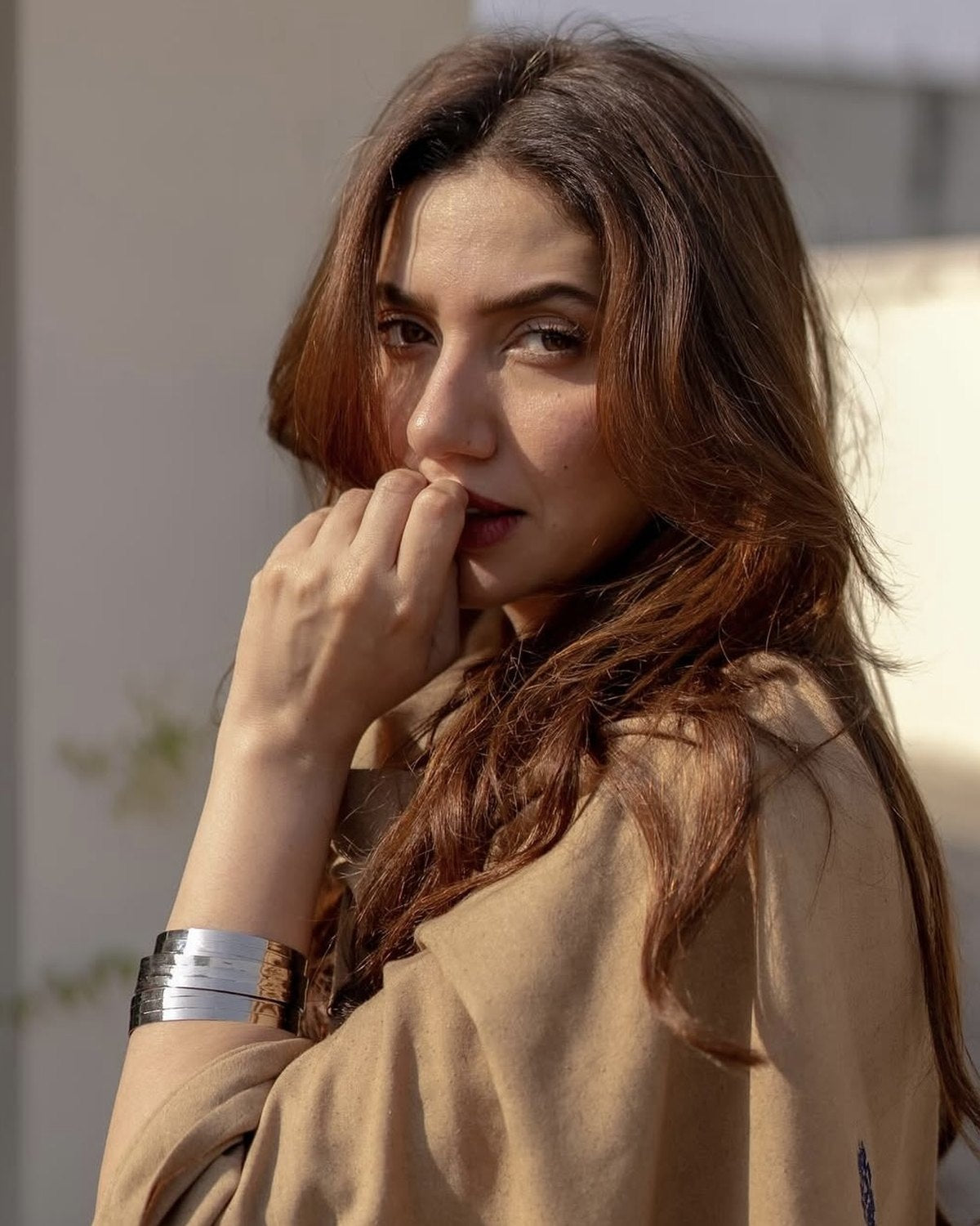 Stacked silver bangles worn as a cuff by The Traditional Jewelry