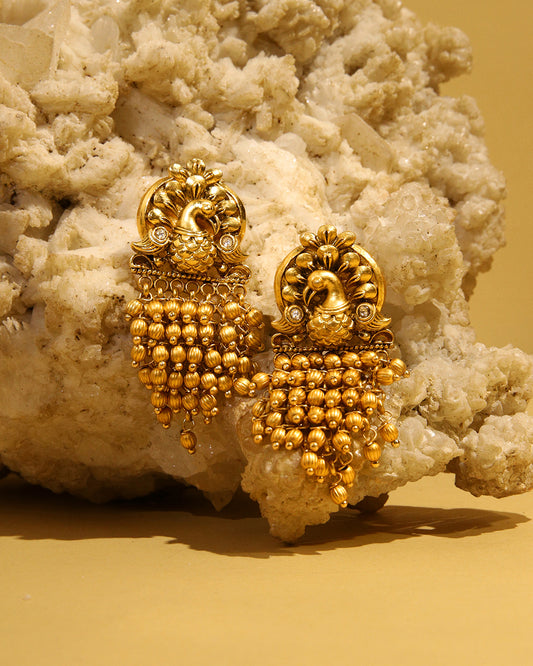 Sunehri gold tone earrings with peacock motif