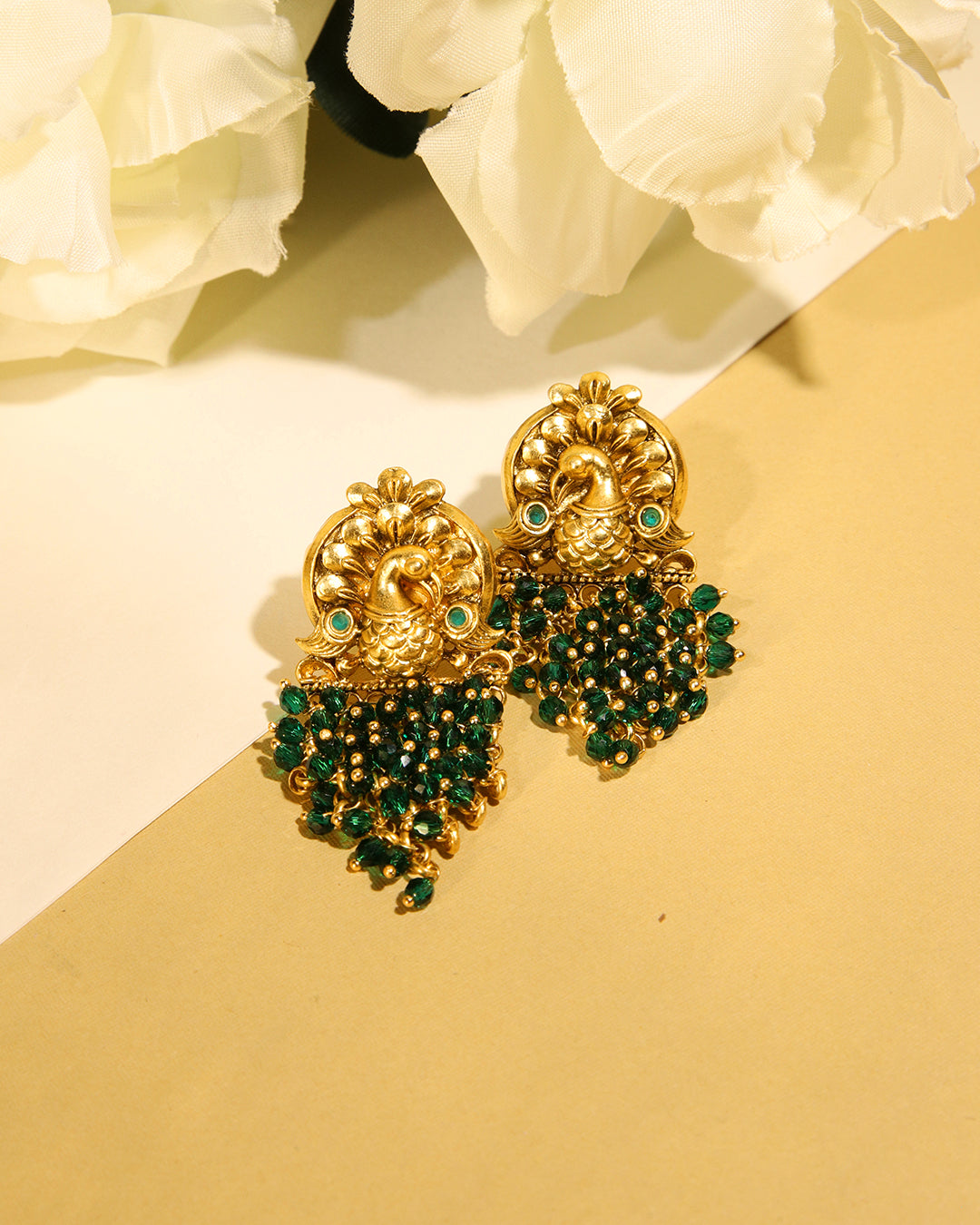 Sunehri gold tone earrings with green peacock motif