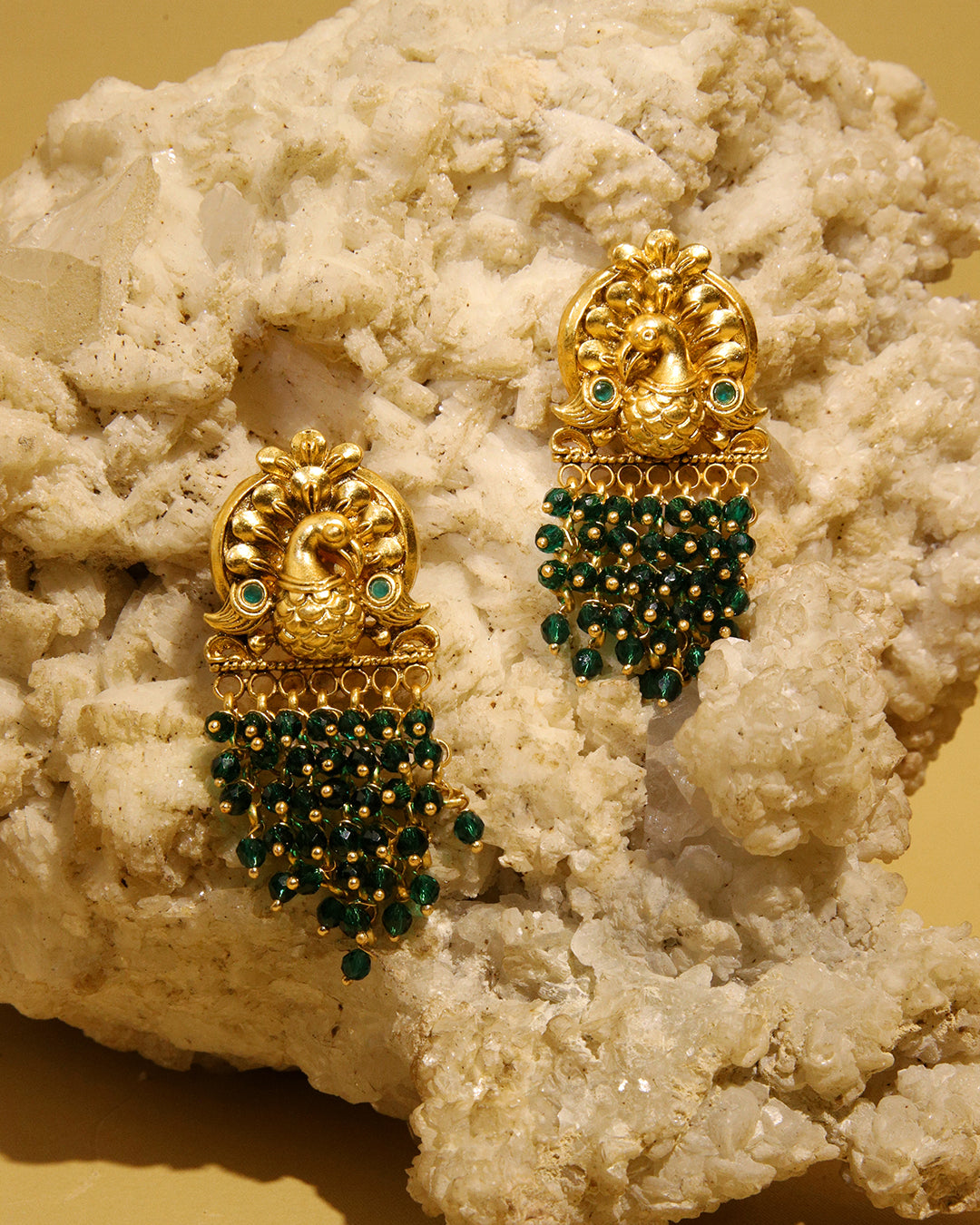 Sunehri gold tone earrings with green peacock motif, view 3